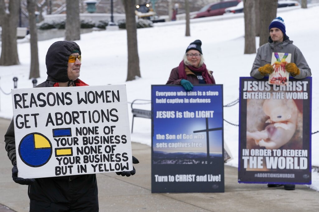 Abortion rights supporter and opponents protest outside Wisconsin capitol building.
