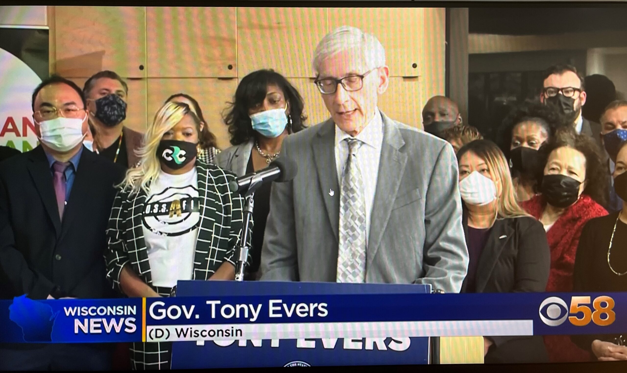 Cynthia Brown, third from left, participates in a March 2022 news conference organized by the Gov. Tony Evers to highlight the small business grant program.