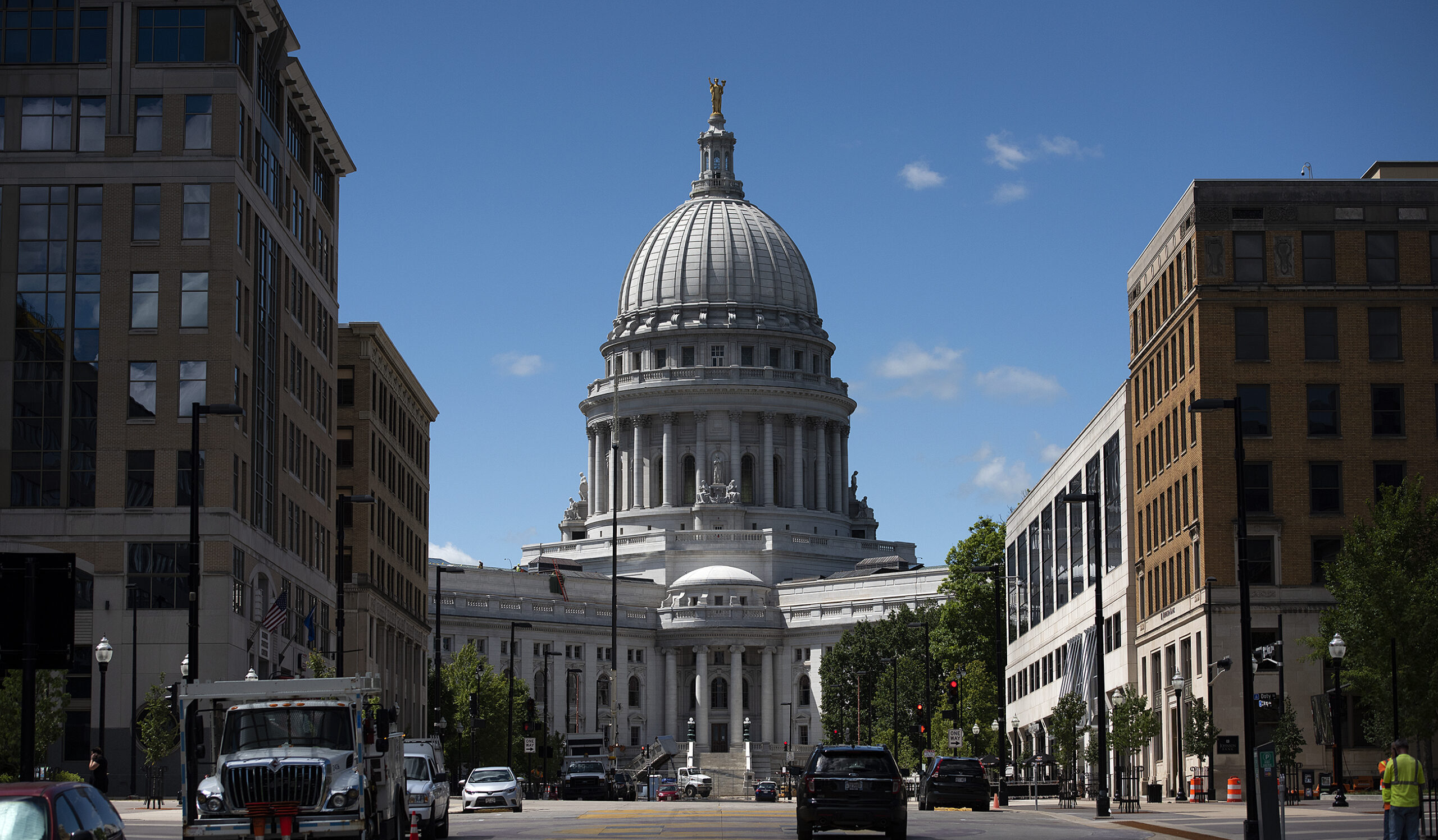 Buildings flank the Wisconsin State Capitol