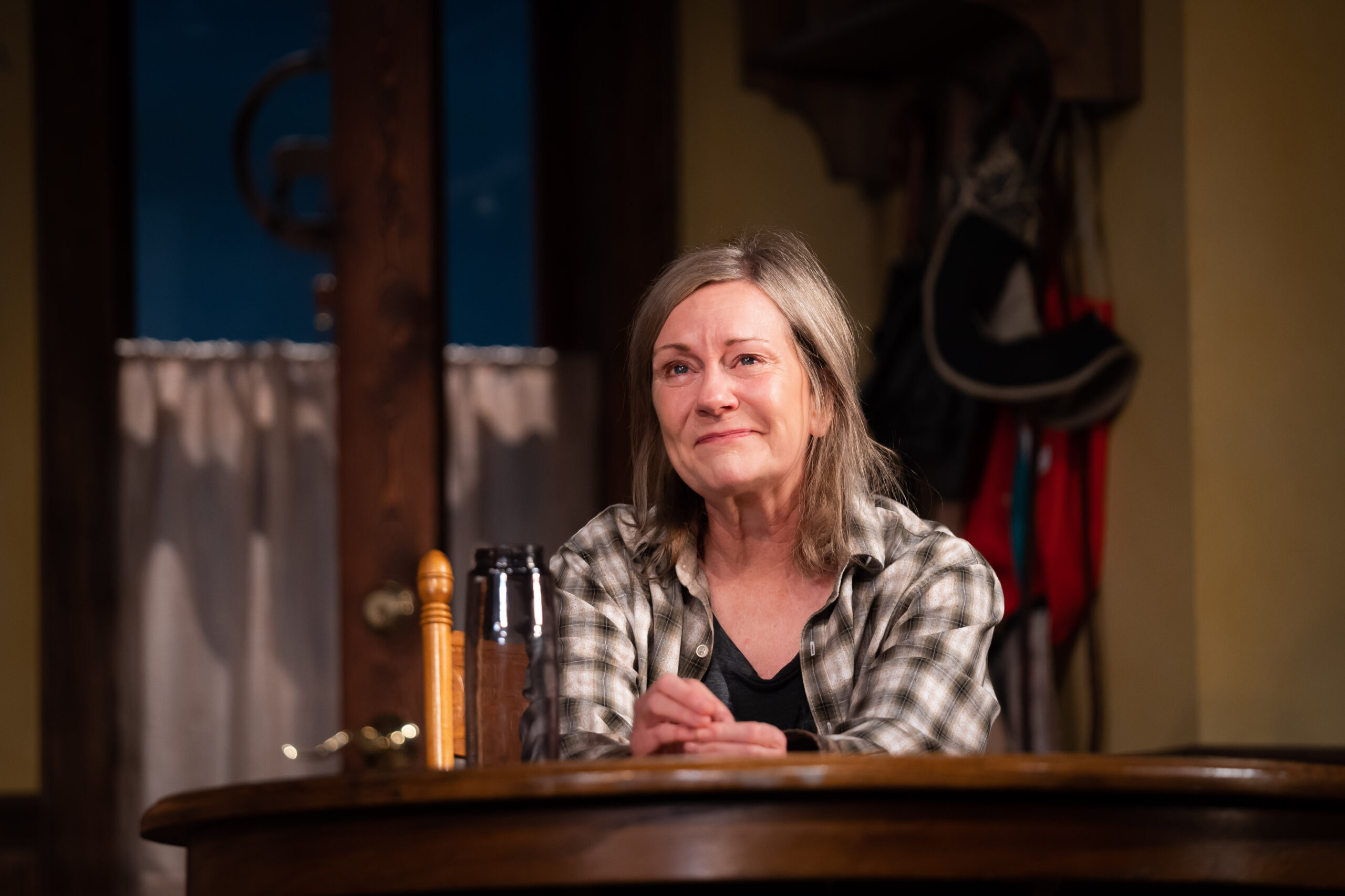 Mary Beth Fisher looks into the spotlight, emotively, as she plays "Peg" in Rebecca Gilman's "Swing State."