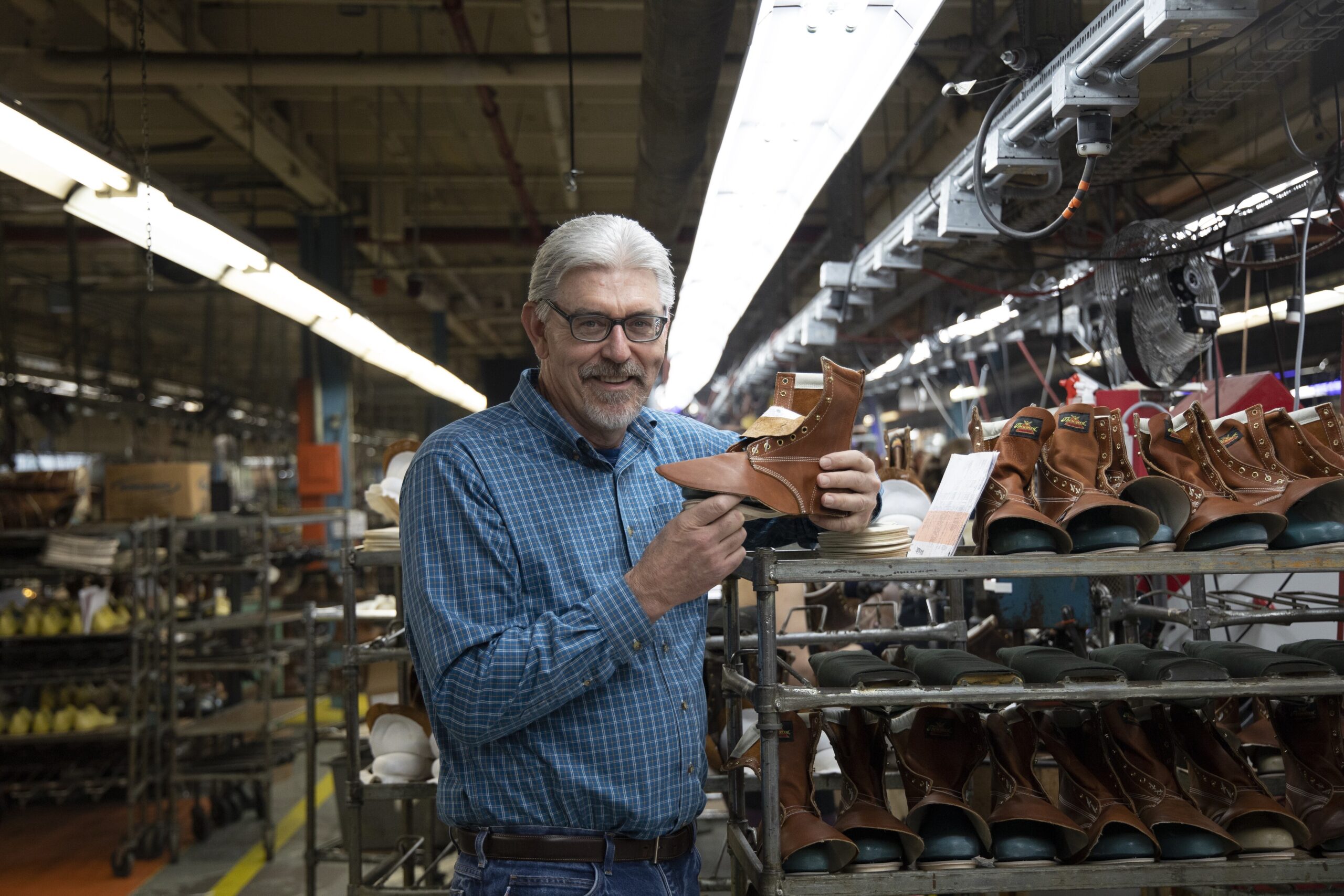 President of Thorogood holding a boot in progress.