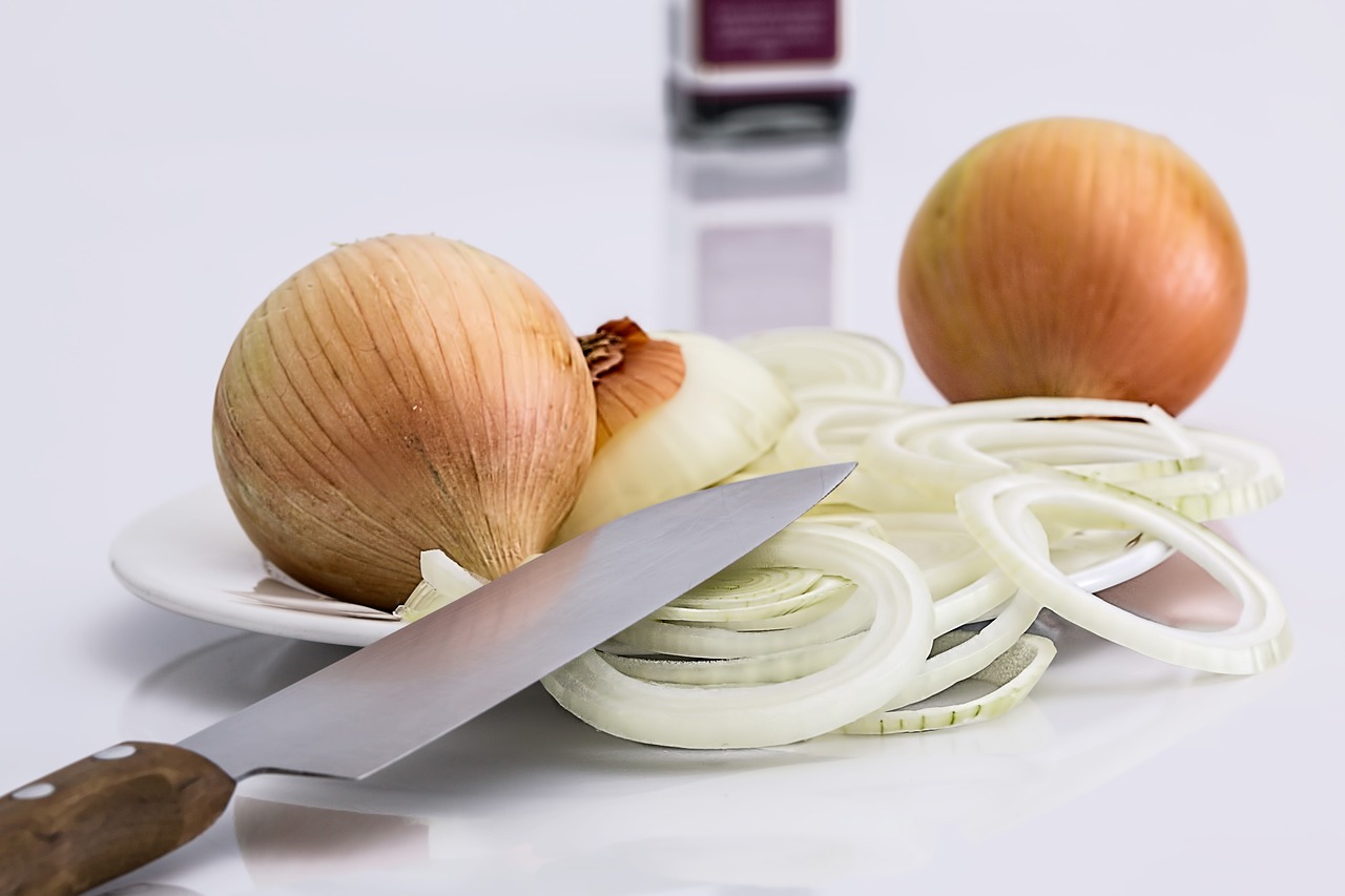 Sliced onion with knife.