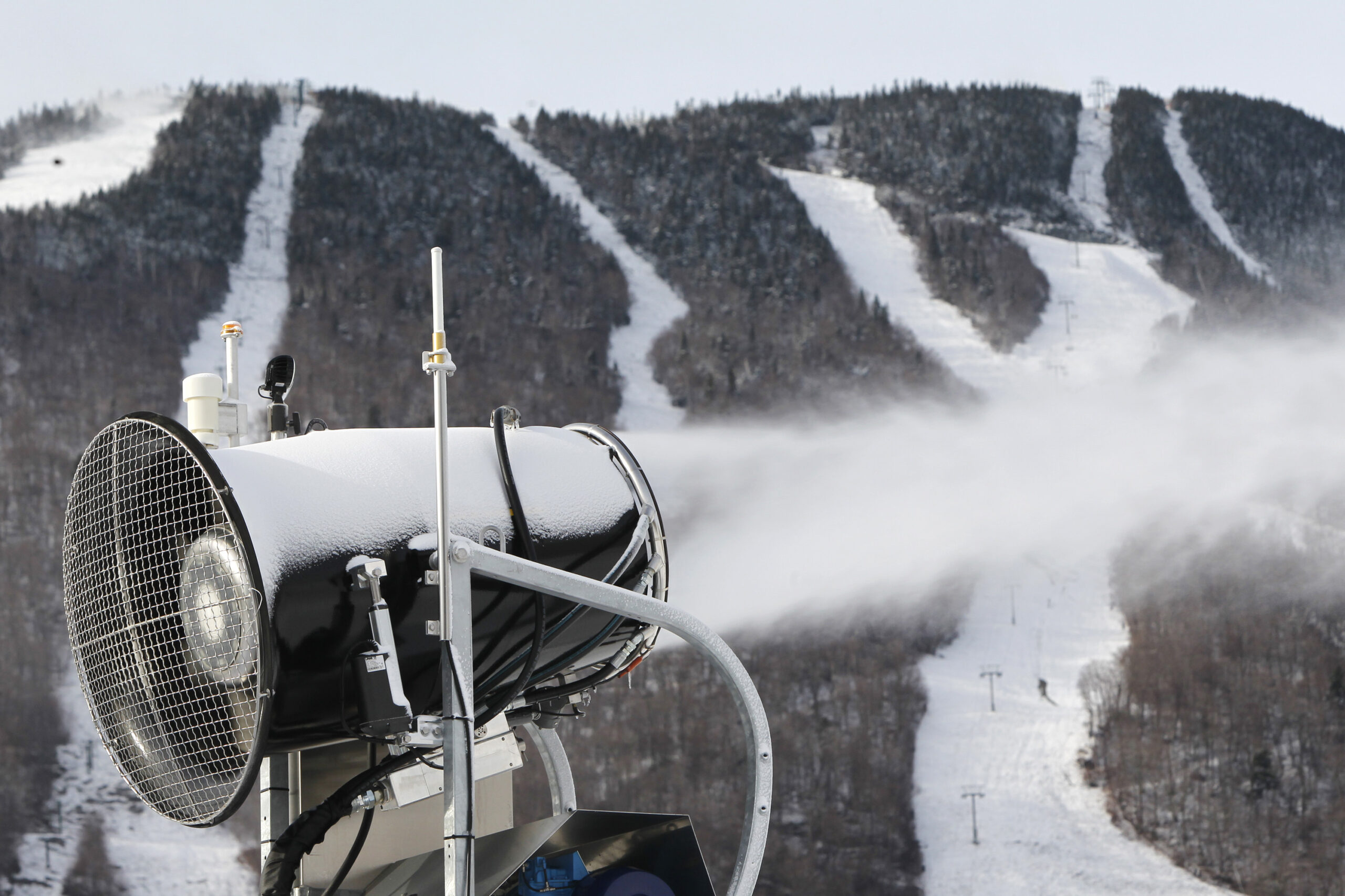 A snow gun makes fresh snow at the Stowe resort in Stowe, Vt.