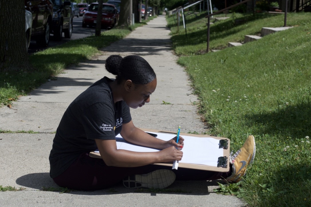 Teonna Cooksey sketches the floorplan of a north side Milwaukee house.
