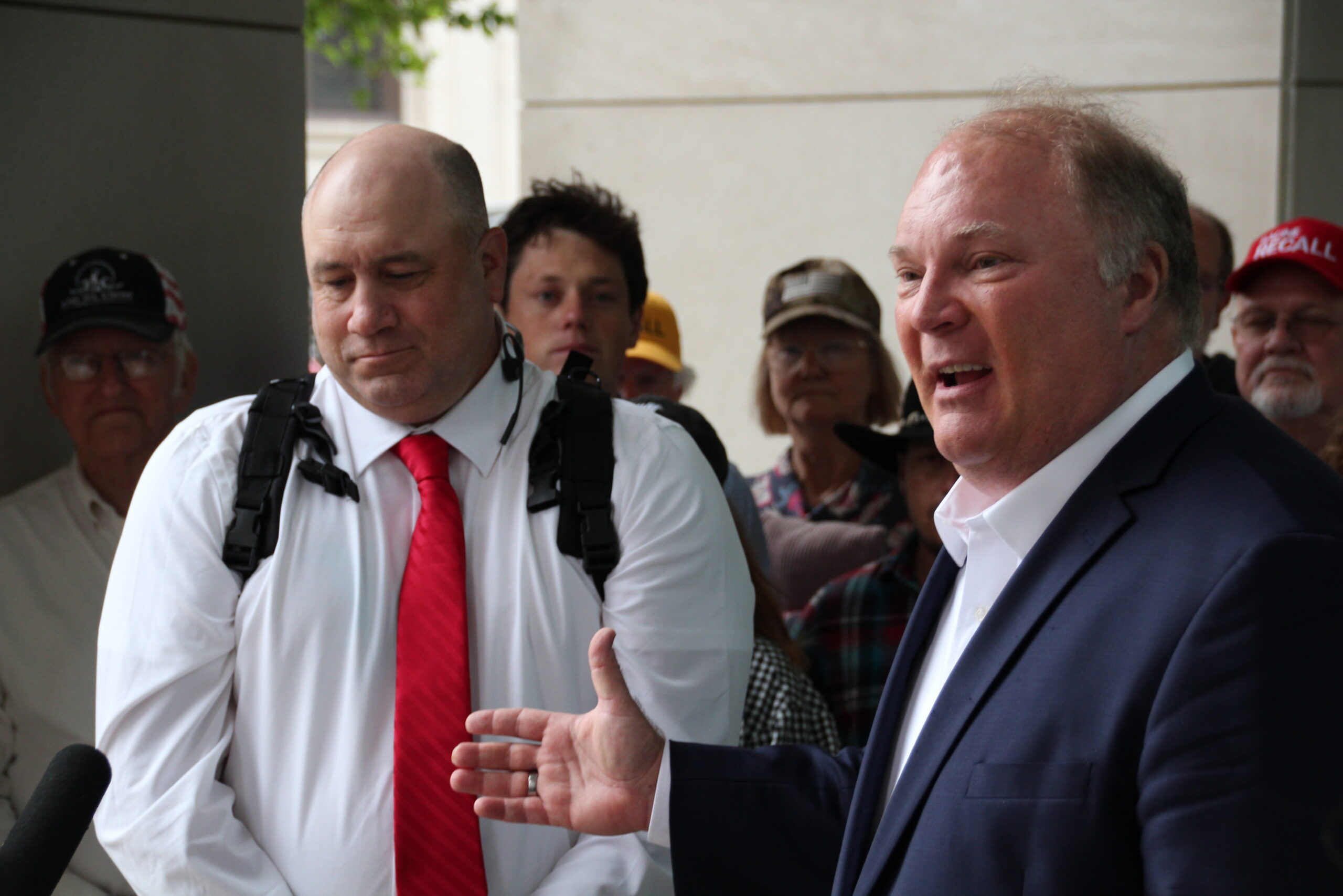 Former Supreme Court Justice Michael Gableman speaks outside the Wisconsin Elections Commission offices in Madison in support of an effort to recall Assembly Speaker Robin Vos. Recall organizer Matthew Snorek (left) said organizers turned in more than 9,000 signatures.