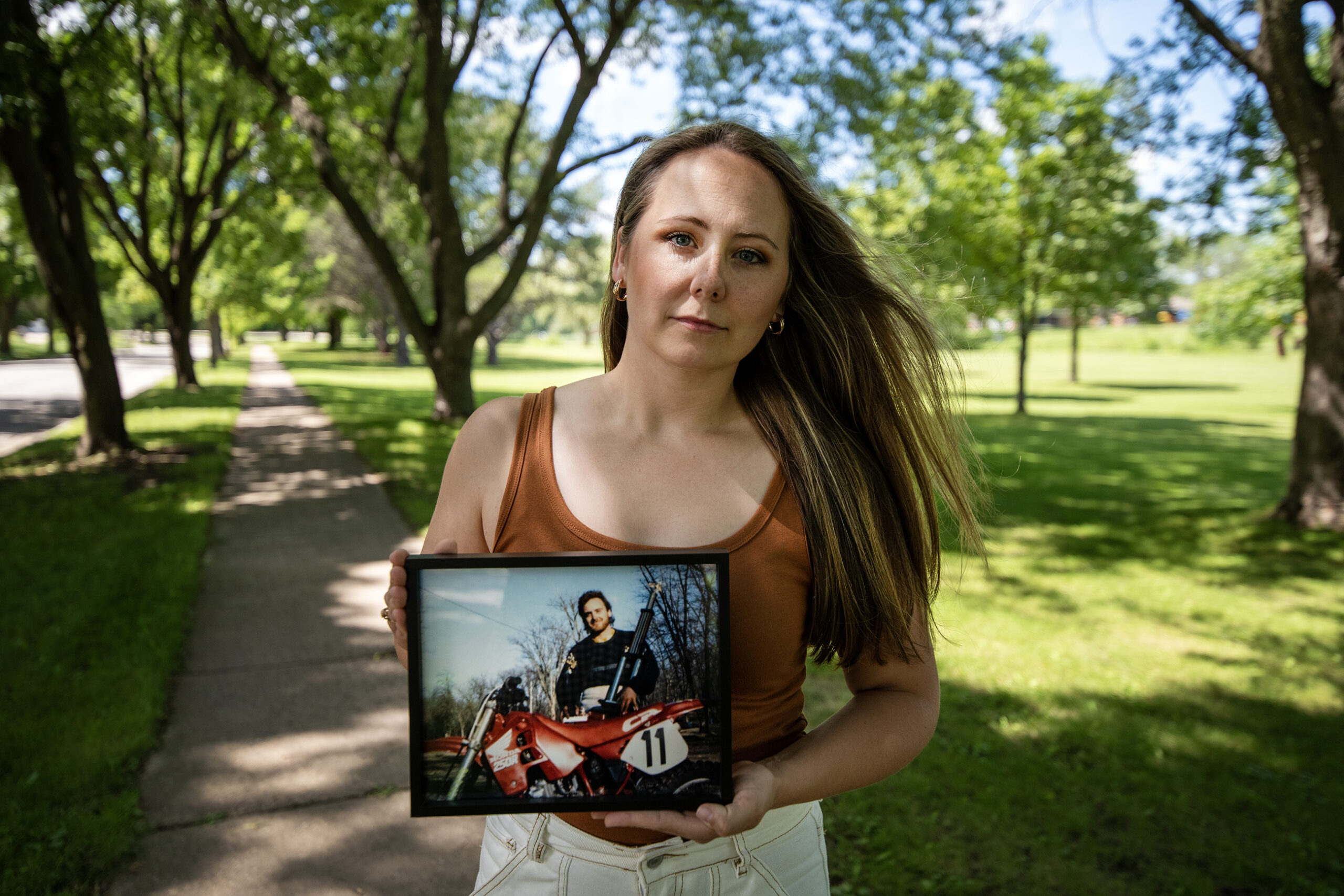 Megan Hoffmann Kolb holds a photo of her father, Dean Hoffmann.