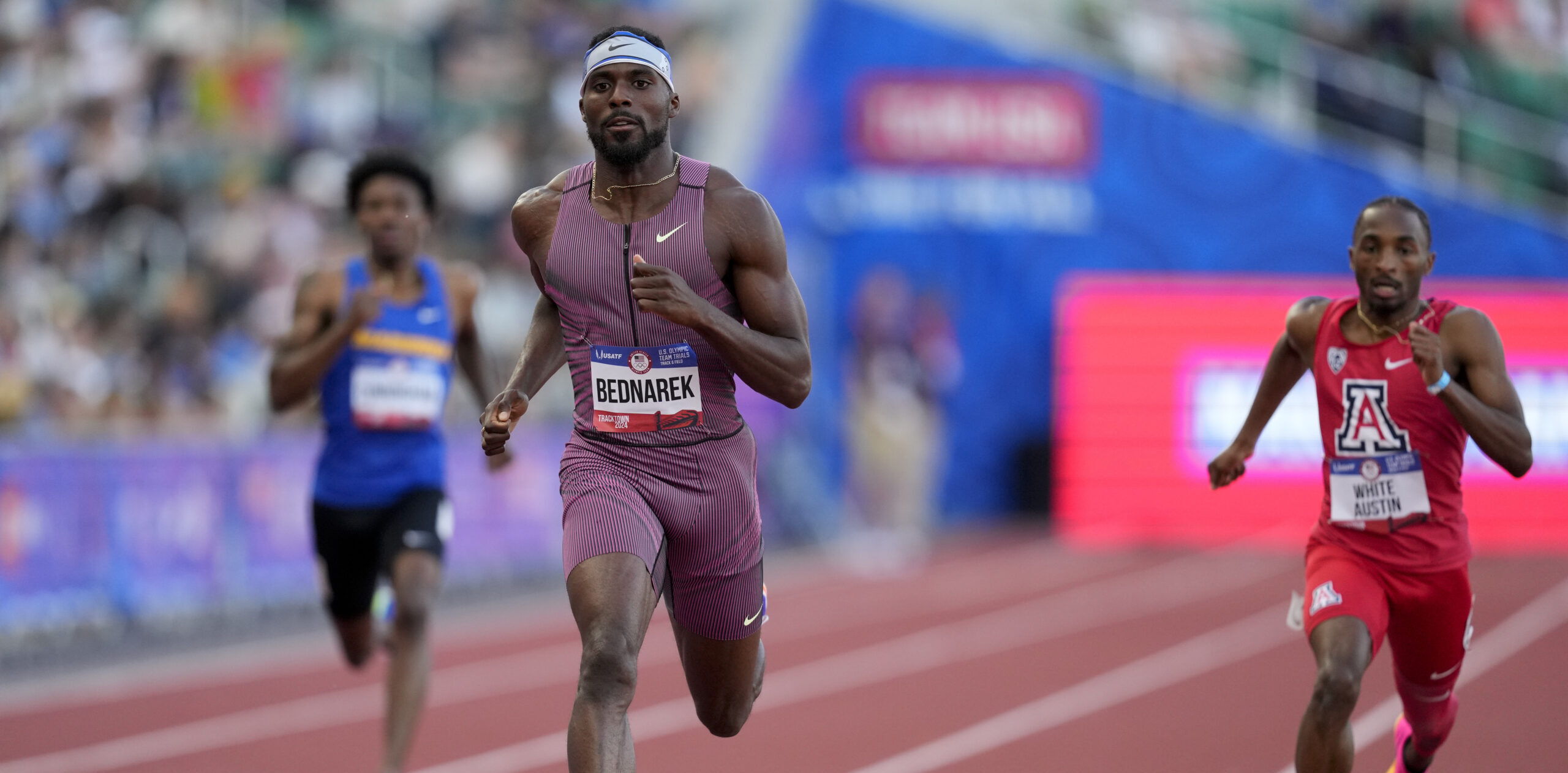 Kenny Bednarek wins a heat in the men's 200-meter run during the U.S. Track and Field Olympic Team Trials Thursday, June 27, 2024, in Eugene, Ore. (AP Photo/Charlie Neibergall)
