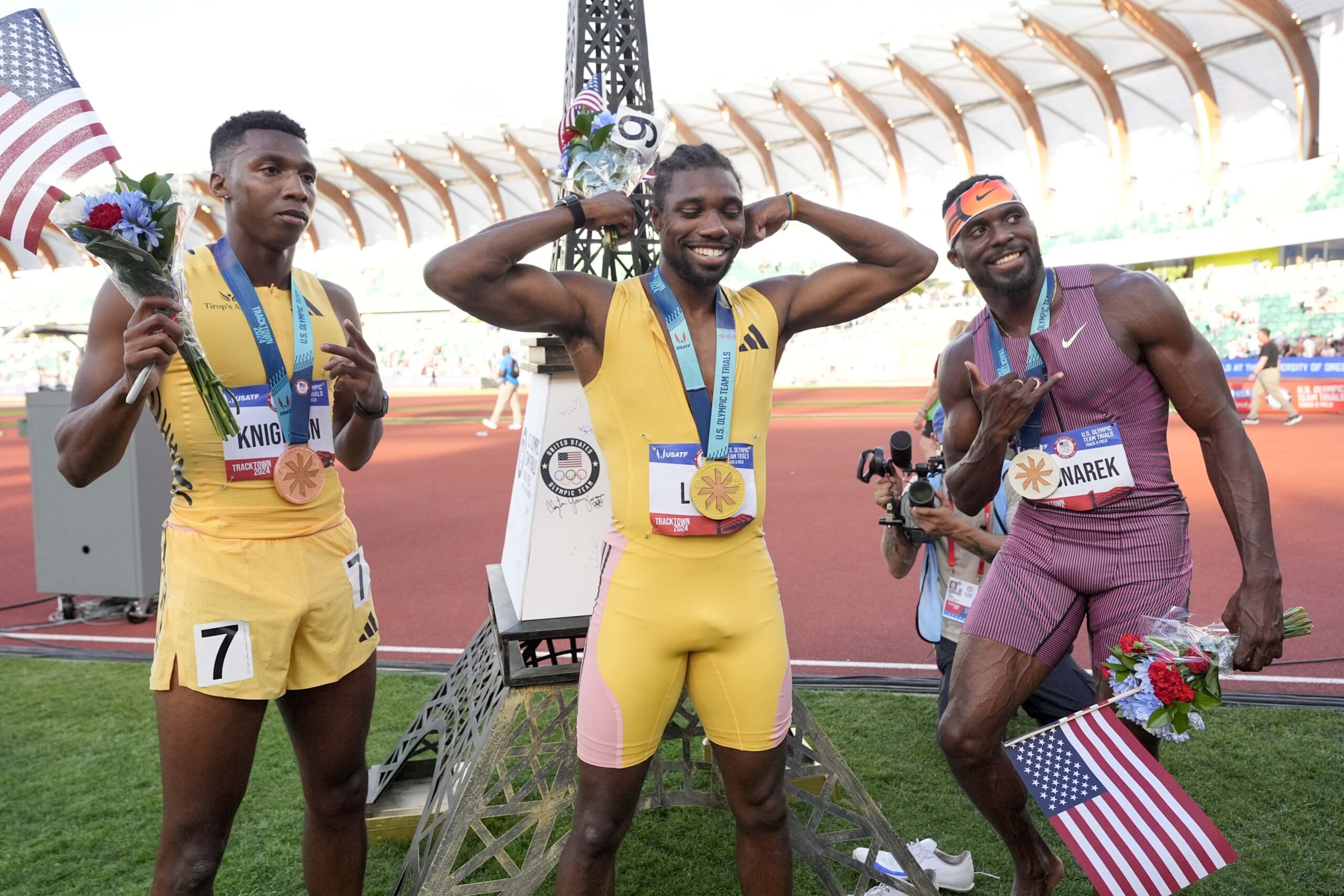 Noah Lyles celebrates after winning the men's 200-meter final with Kenny Bednarek and Erriyon Knighton during the U.S. Track and Field Olympic Team Trials Saturday, June 29, 2024, in Eugene, Ore. (AP Photo/George Walker IV)