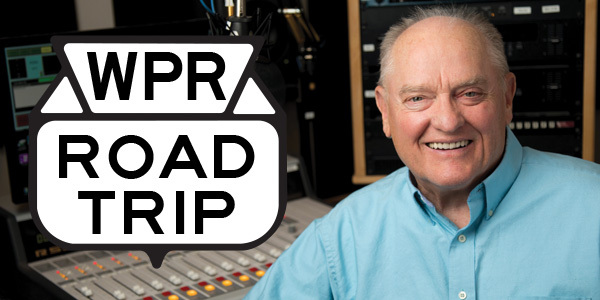 Larry Meiller in studio with the WPR Road Trip logo