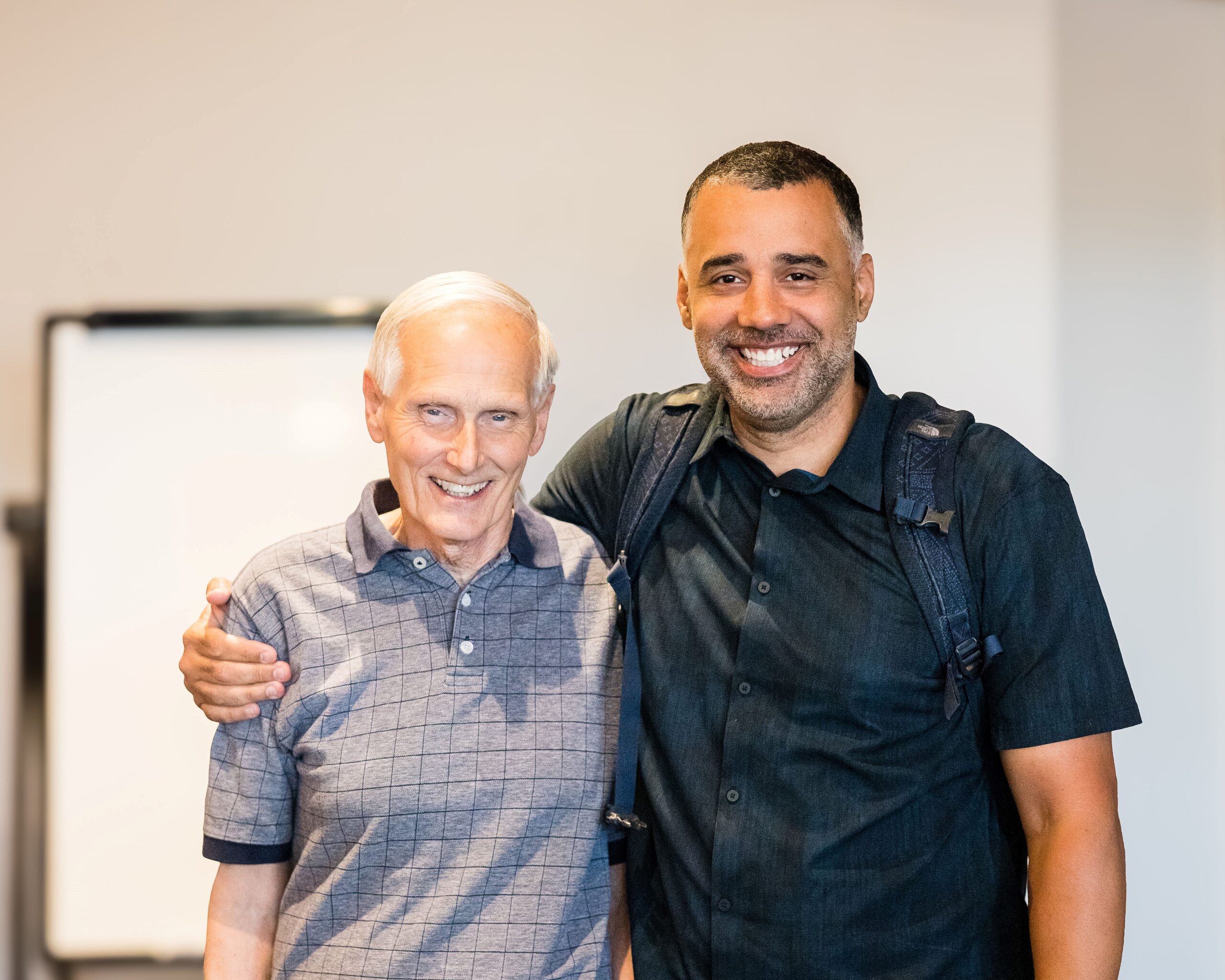 Shawn Robinson poses with his arm around Bill Kitz