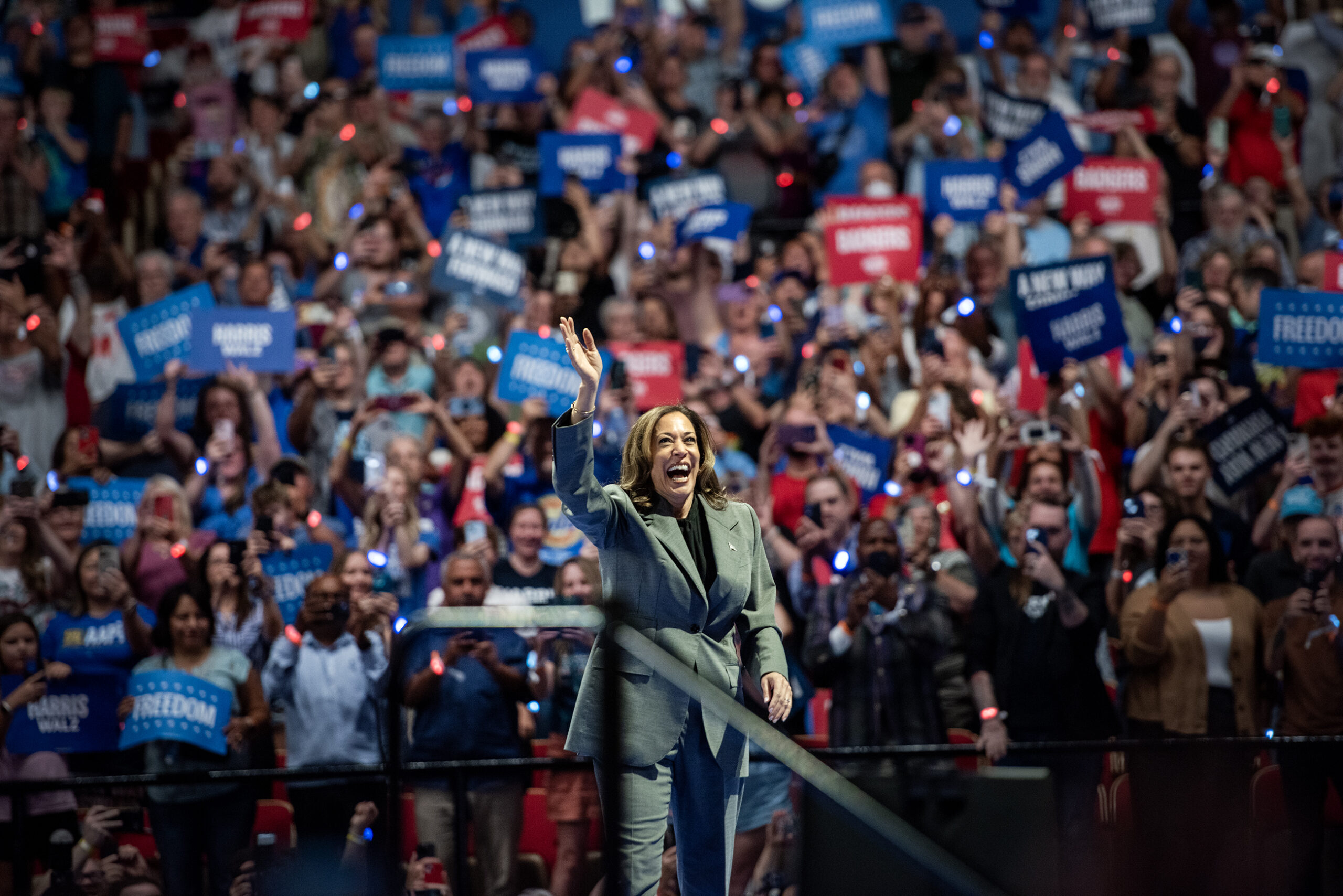 Vice President Kamala Harris waves to attendees as she takes the stage at a campaign rally Friday, Sept. 20, 2024, at the Alliant Energy Center in Madison, Wis. Angela Major/WPR