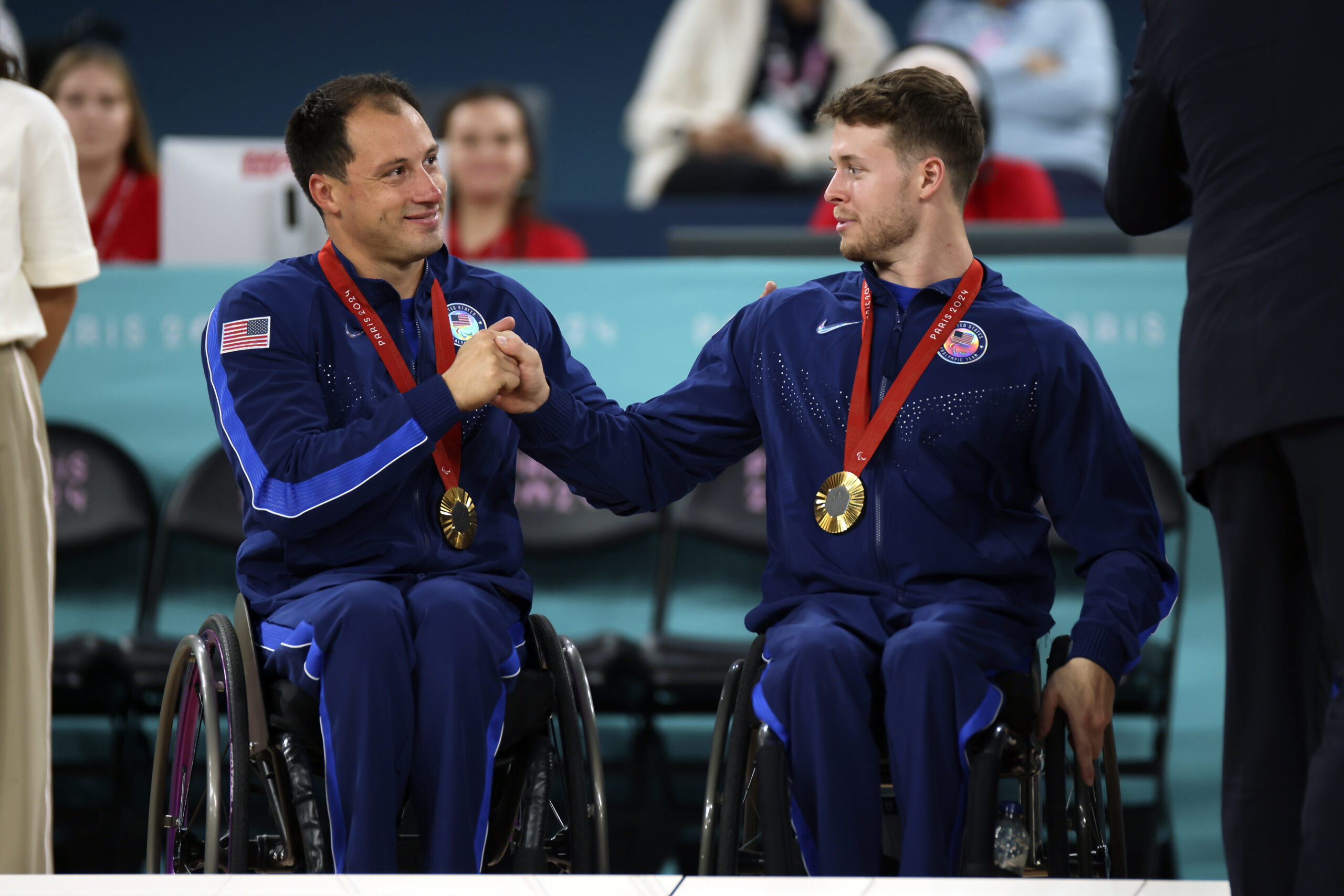 Jake Williams, left, and Talen Jourdan of the U.S. pose with their gold medals after winning the wheelchair basketball men's gold medal match at the 2024 Paralympics, Saturday, Sept. 7, 2024, in Paris, France.