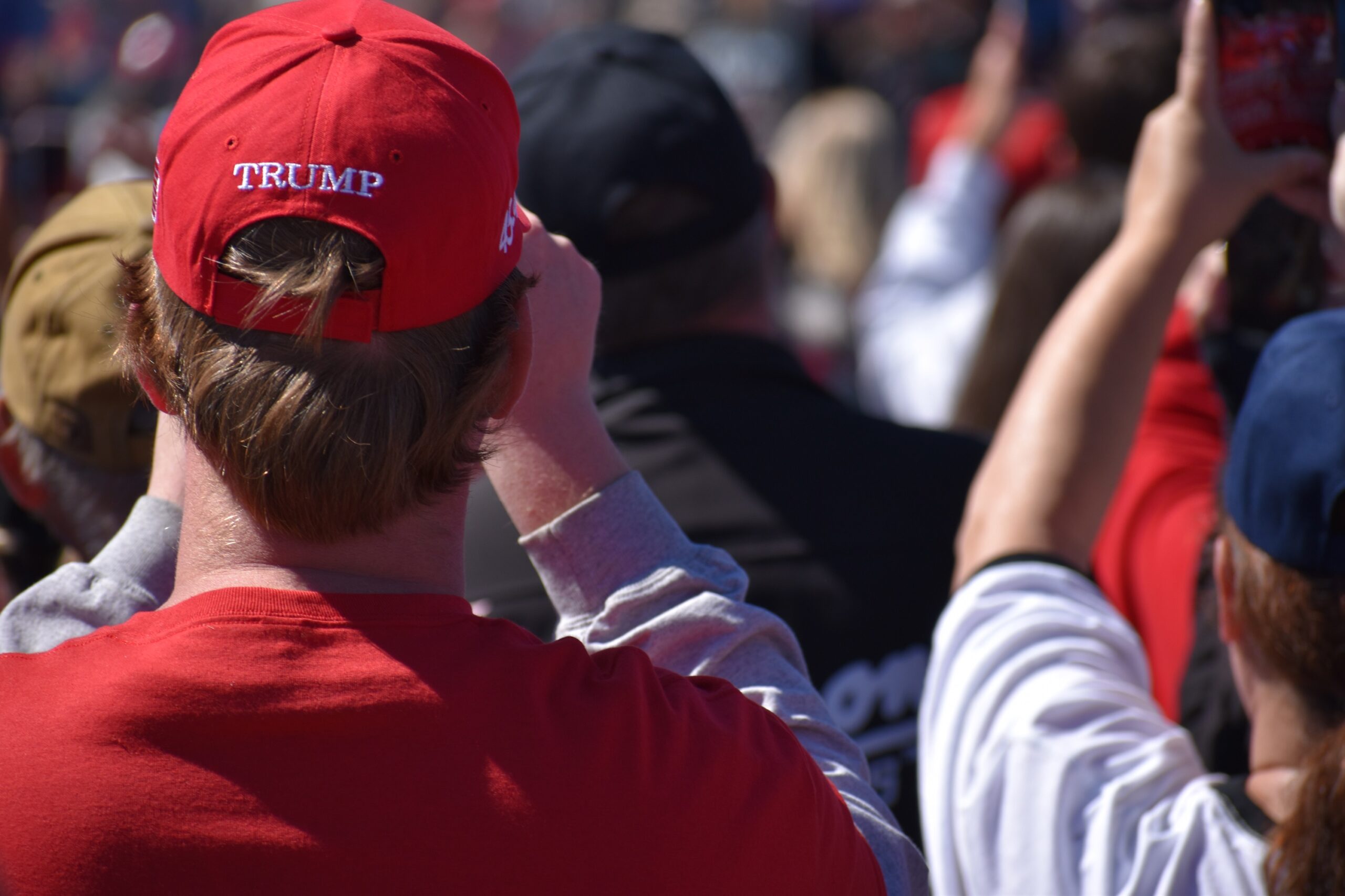 A supporter wears a Trump hat at the Mosinee campaign event.