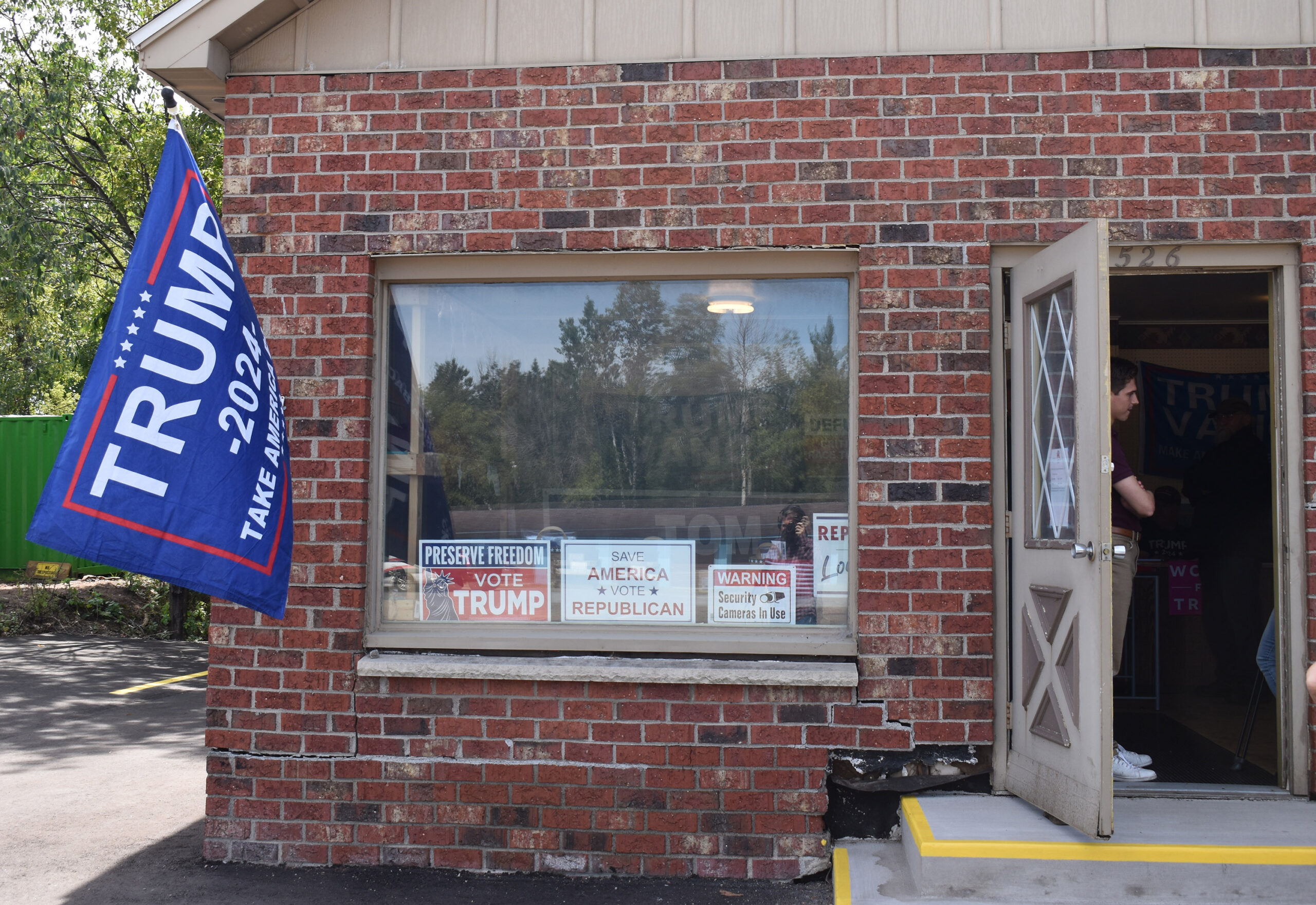 A Trump 2024 flag flies outside the Oneida County Republican Party headquarters in Rhinelander.