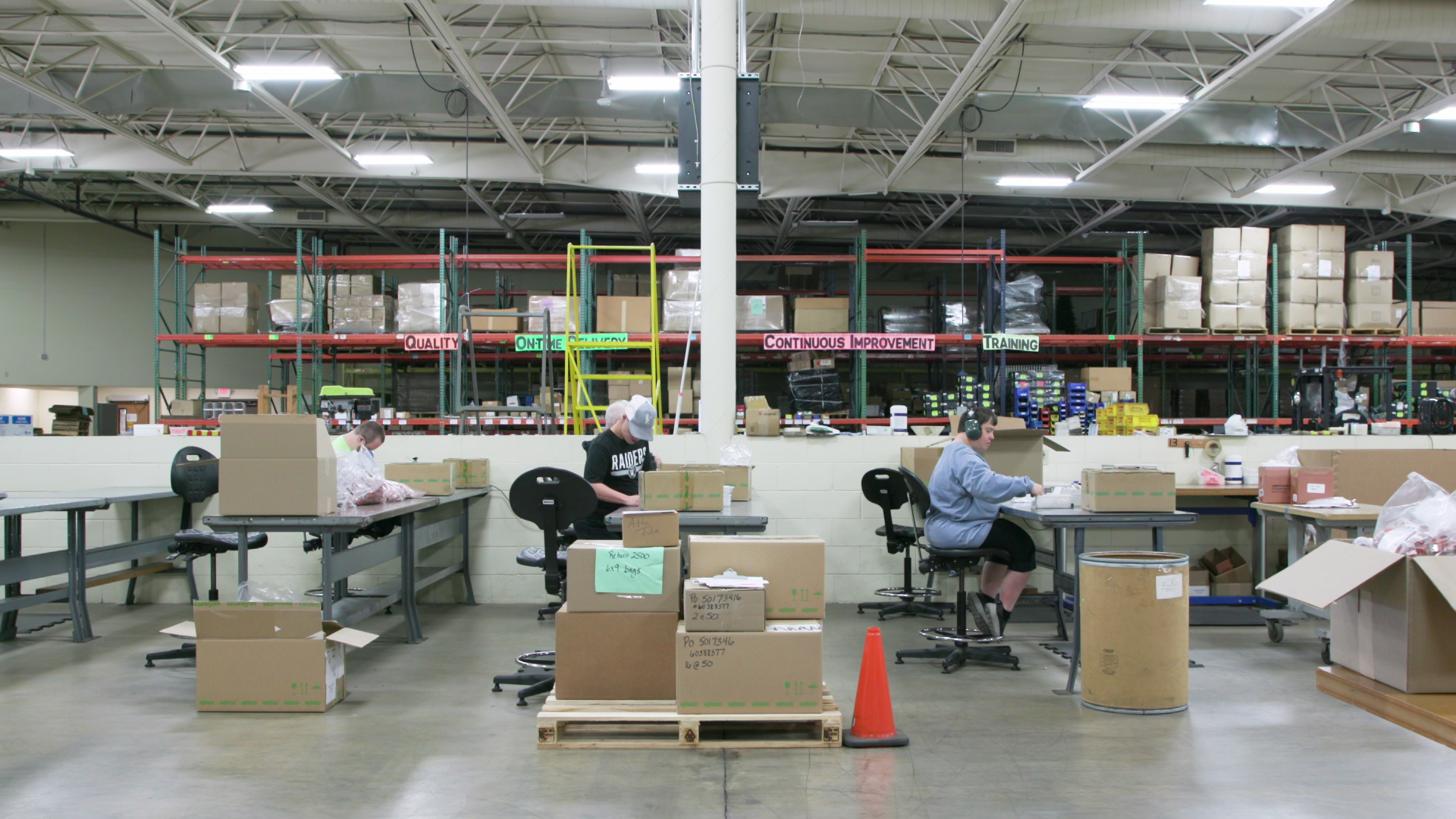 Employees of TTI Industries work at a warehouse