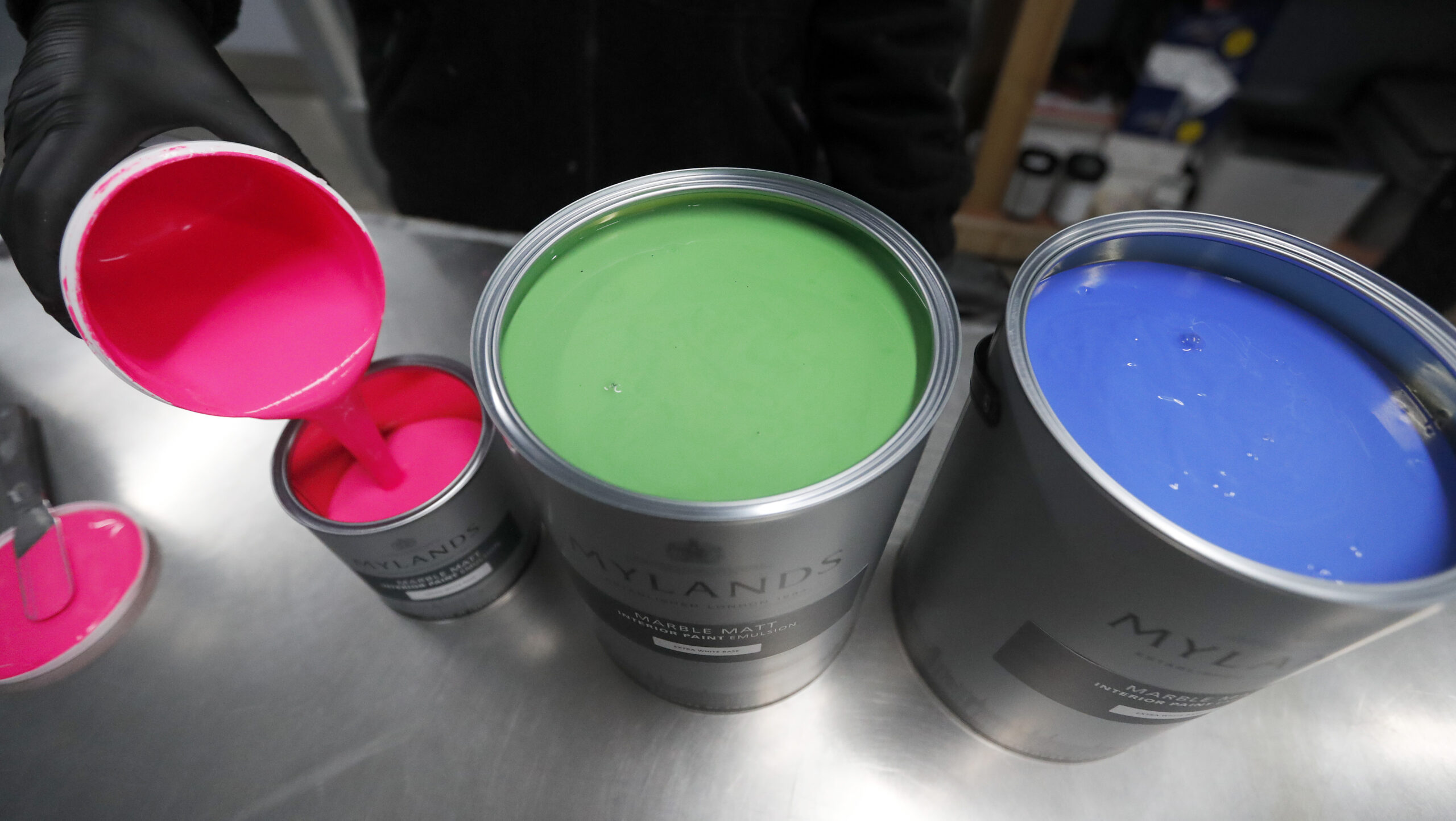 Three paint cans in a row. 