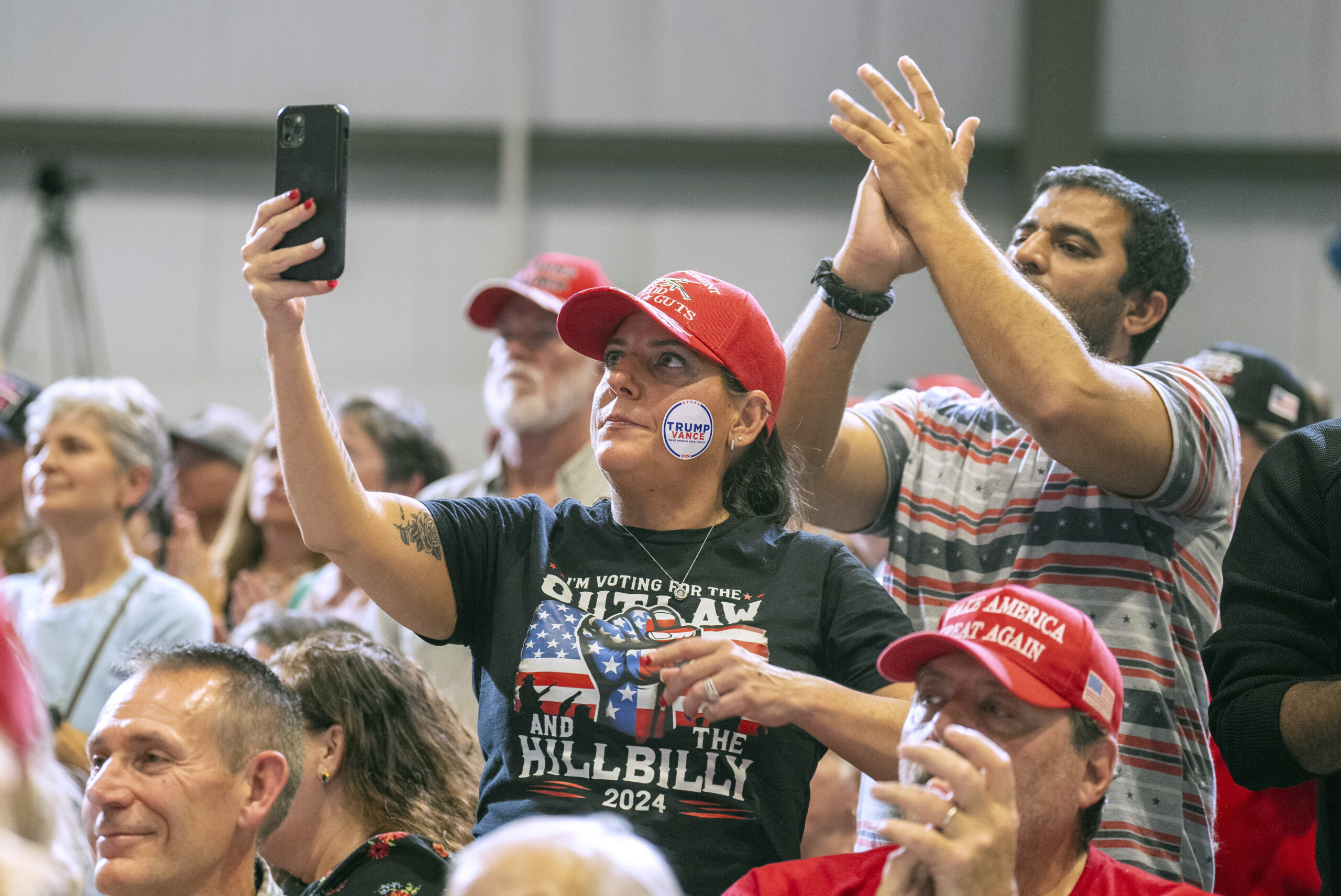 Supporters of Republican vice presidential nominee Sen. JD Vance, R-Ohio, watch during a campaign event Sunday, Oct. 20, 2024, in Waukesha, Wis.