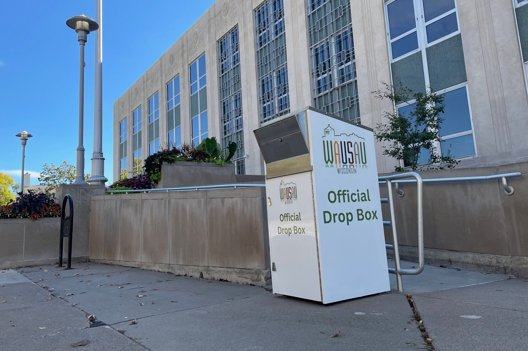 A ballot drop box was returned to outside City Hall on Sept. 30, 2024 after it was removed a week earlier by the city's mayor.