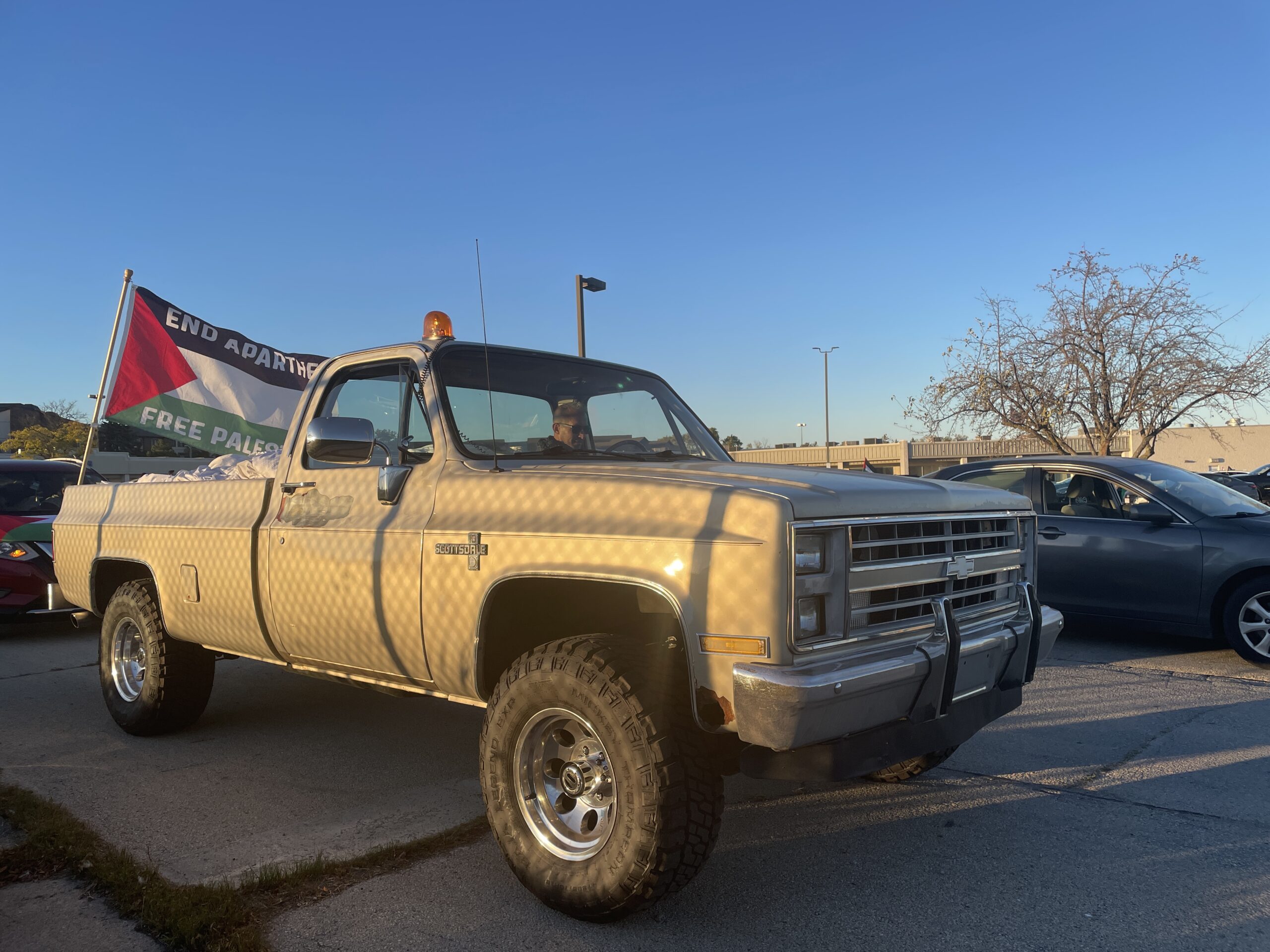 Cars line up for a "Car Caravan Funeral Procession" to Derco Aerospace to protest the US's involvement in the Israel-Gaza war on October 7, 2024.