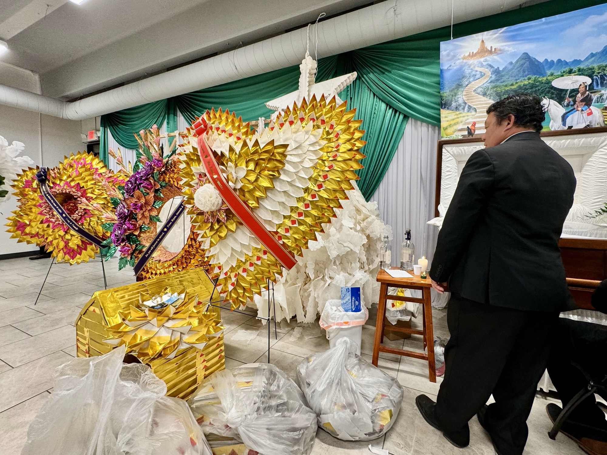 ‘Sending love her way’: Folding money boats to remember departed loved ones