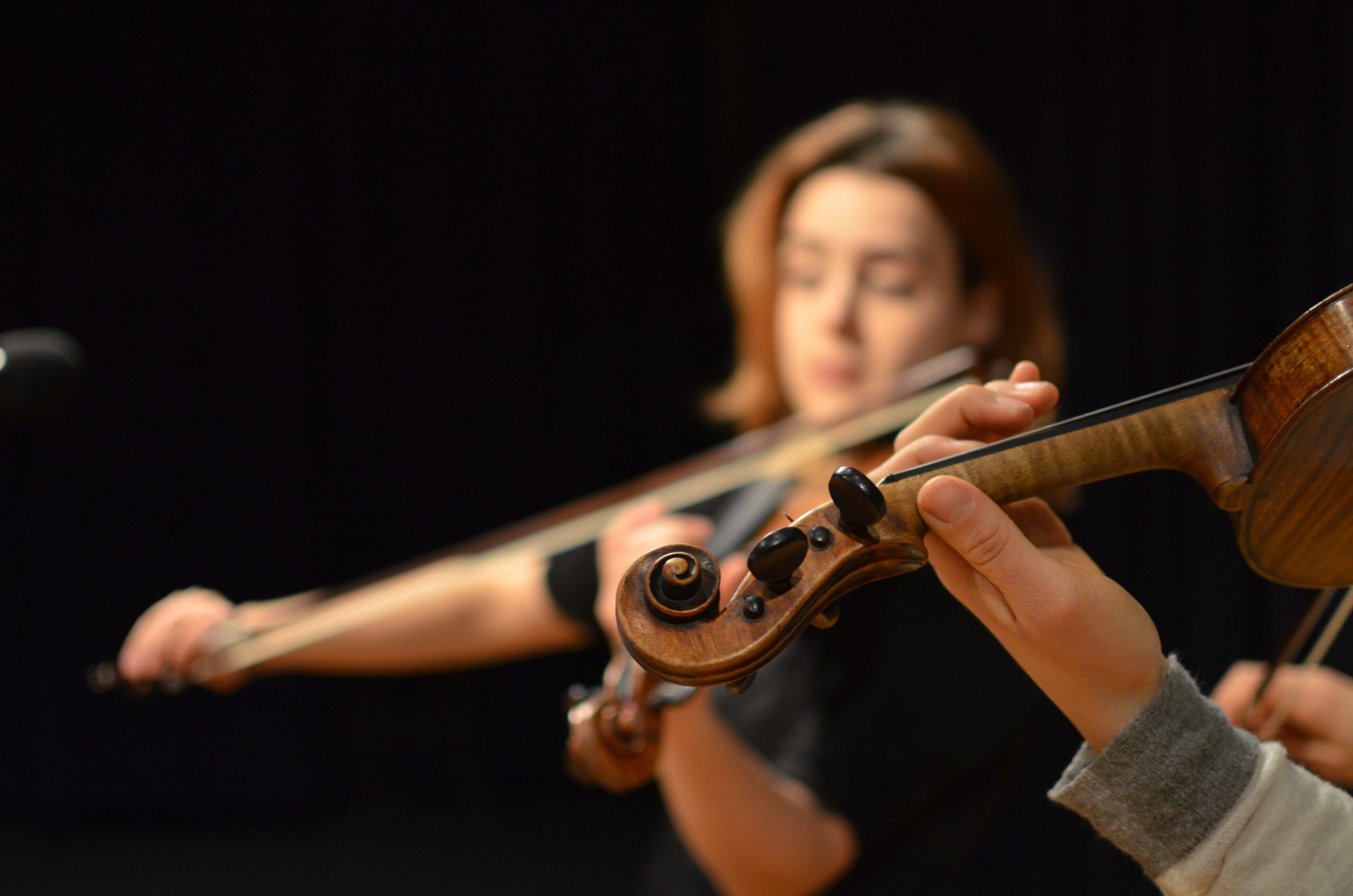 An image of two women playing violas in a live broadcast from WPR's studios in Madison, Wisconsin.