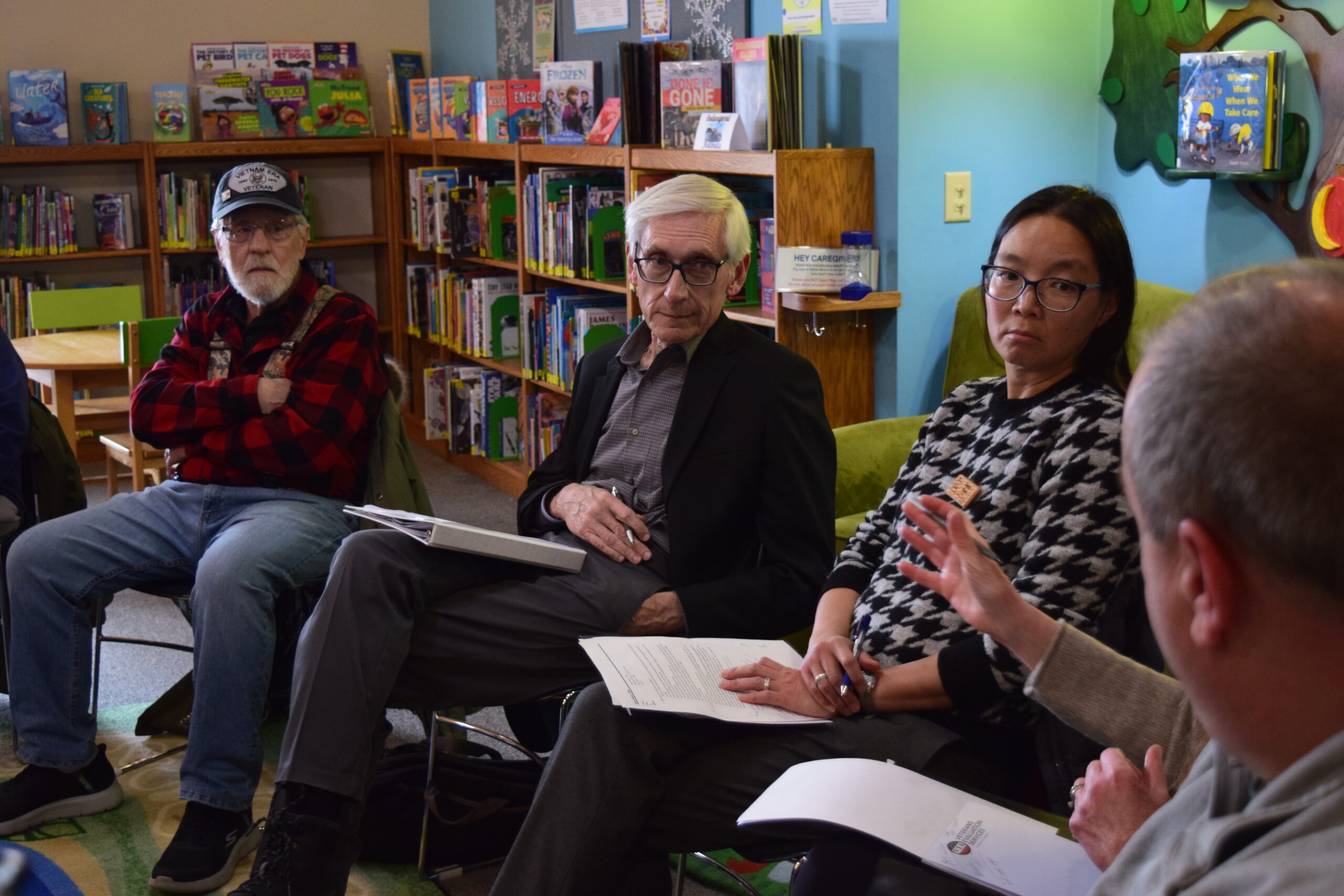 Gov. Tony Evers and DNR Secretary Karen Hyun speak with Campbell residents.